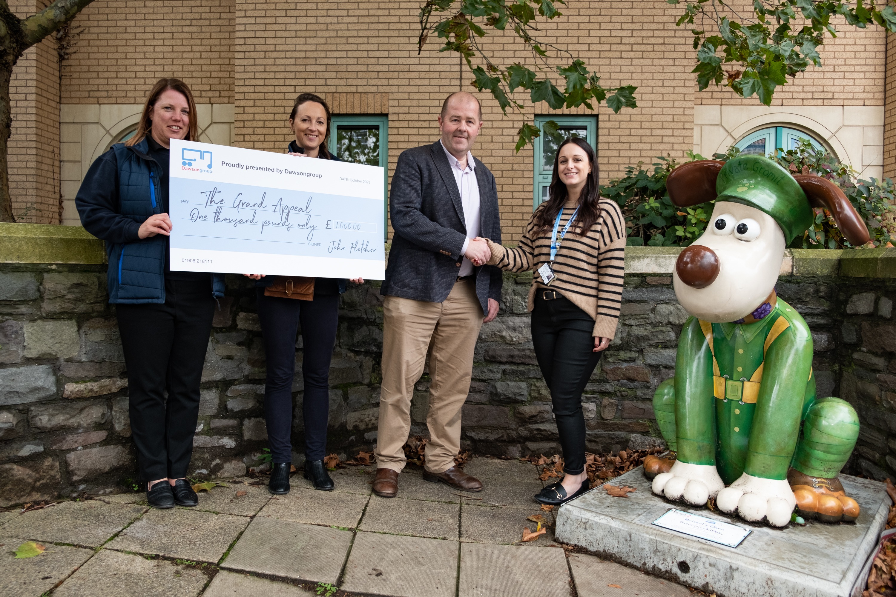 Dawsongroup truck and trailer presenting the charity cheque to the Grand Appeal.